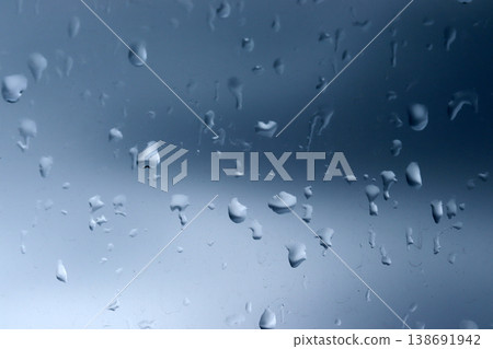 Water drops of rain on glass background Water drops of rain on glass background 138691942