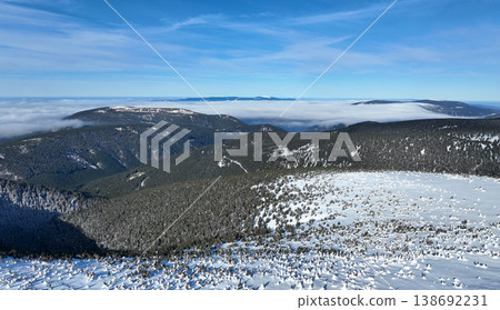 Jeseniky winter ice form spruce tree Picea forest snow frost cold cool ice tundra biome frigid temperature aerial drone birds eye top view footage. Famous tourist place in Hruby Jesenik mountains Jeseniky winter ice form spruce tree Picea forest snow frost cold cool ice tundra biome frigid temperature aerial drone birds eye top view footage. Famous tourist place in Hruby Jesenik mountains 138692231