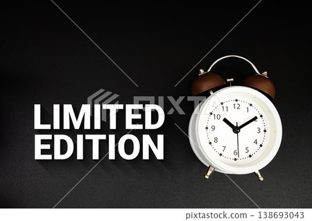 Limited Edition text with alarm clock on black background Limited Edition text with alarm clock on black background 138693043