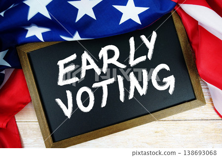 American flag with blackboard "Early Voting" on wooden background American flag with blackboard "Early Voting" on wooden background 138693068