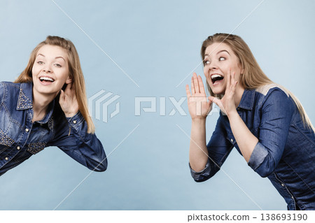 Two women telling tales, rumors gossip 138693190