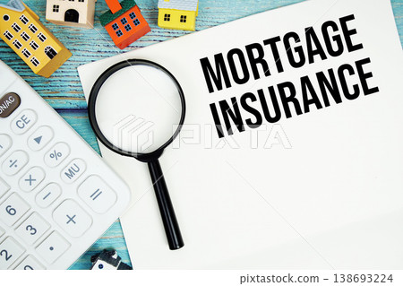 Notepad with "Mortgage Insurance" with Calculator, magnifying glass and house model on wooden background Notepad with "Mortgage Insurance" with Calculator, magnifying glass and house model on wooden background 138693224