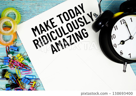 Make Today Ridiculously Amazing text with alarm clock and colorful office supplies on a blue wooden surface Make Today Ridiculously Amazing text with alarm clock and colorful office supplies on a blue wooden surface 138693400