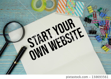 Start Your Own Website text written on notepad with magnifying glass flat lay on wooden background Start Your Own Website text written on notepad with magnifying glass flat lay on wooden background 138693561