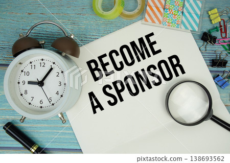 Become A Sponsor text written on notepad with alarm clock and magnifying glass flat lay on wooden background Become A Sponsor text written on notepad with alarm clock and magnifying glass flat lay on wooden background 138693562