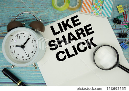 Like Share Click text written on notepad with alarm clock and magnifying glass flat lay on wooden background Like Share Click text written on notepad with alarm clock and magnifying glass flat lay on wooden background 138693565