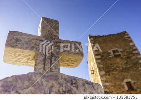 Greek stone cross and tower house, Greece 138693755