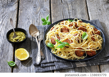 Pasta linguine with meatballs, pesto sauce, lemon Pasta linguine with meatballs, pesto sauce, lemon 138693770