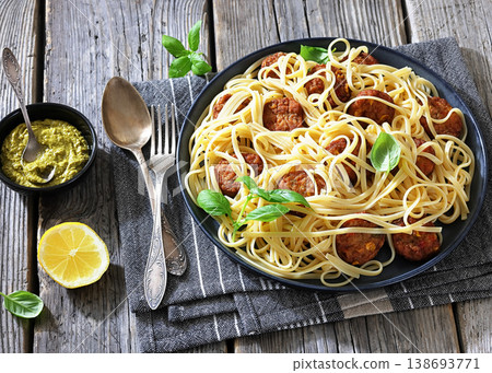 Pasta linguine with meatballs, pesto sauce, lemon Pasta linguine with meatballs, pesto sauce, lemon 138693771