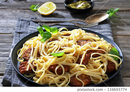 Pasta linguine with meatballs, pesto sauce, lemon Pasta linguine with meatballs, pesto sauce, lemon 138693774