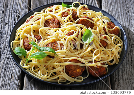 Pasta linguine with meatballs, pesto sauce, lemon 138693779