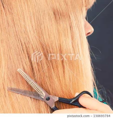 Blonde girl makes new hair image. Blonde girl makes new hair image. 138693784