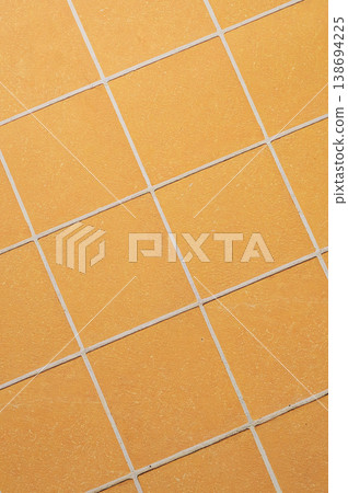 Orange ceramic tile background in a minimalist style. Interior design concept. Orange ceramic tile background in a minimalist style. Interior design concept. 138694225
