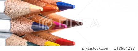 Macro close-up of vibrant pencil leads clustered on the left with ample copy space 138694288