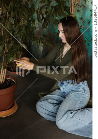 Instructional scene showing precise leaf trimming technique 138694417