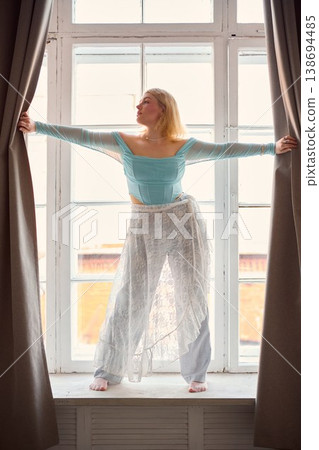 Sunshine illuminates lady crafting melodies in calm city dawn 138694485