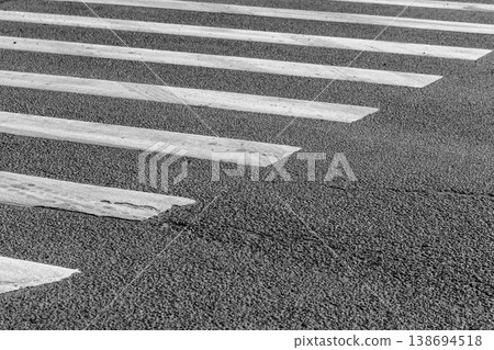 Monochrome closeup of a zebra crossing crosswalk, abstract 138694518