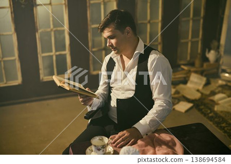 Woman studies draft with warm ambiance and vintage setting Woman studies draft with warm ambiance and vintage setting 138694584