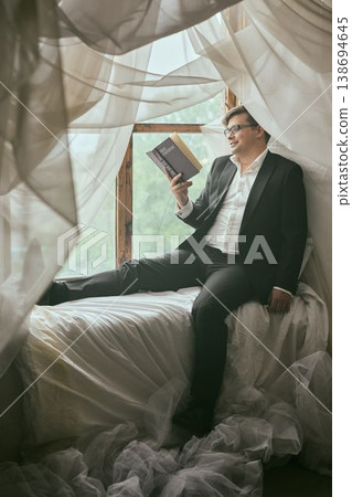Sophisticated man studying important documents in natural light Sophisticated man studying important documents in natural light 138694645
