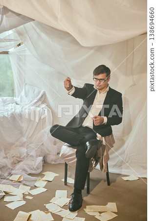Casual studio shot of composed business advisor with notes Casual studio shot of composed business advisor with notes 138694660