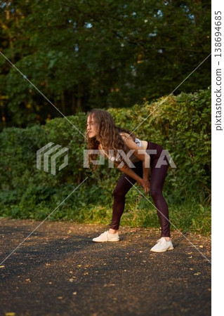 Female coach demonstrating unilateral functional reach with weight 138694685