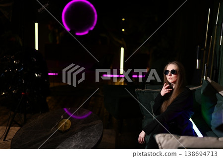 Casual female founder studying in vibrant city lounge ambiance 138694713