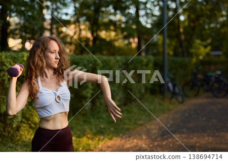 Caucasian pilates enthusiast practicing coordinated arm control Caucasian pilates enthusiast practicing coordinated arm control 138694714