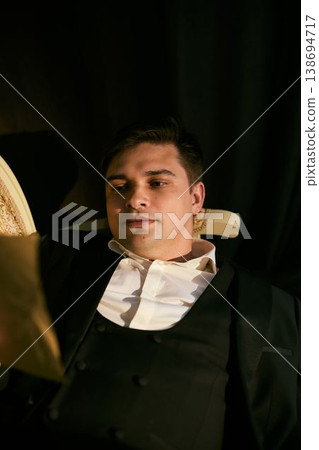 Thoughtful man with classic attire and subdued background Thoughtful man with classic attire and subdued background 138694717