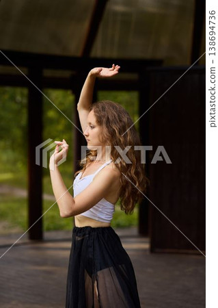 Caucasian woman interpretive dancer in reflective pose Caucasian woman interpretive dancer in reflective pose 138694736