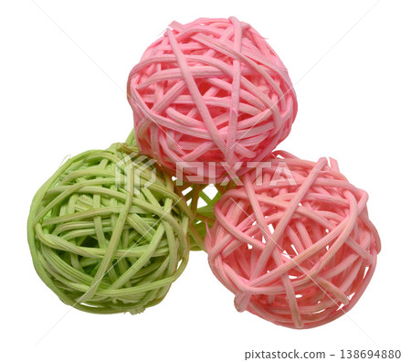 Pink and green rattan wicker ball on isolated background as a decorative element for interior Pink and green rattan wicker ball on isolated background as a decorative element for interior 138694880