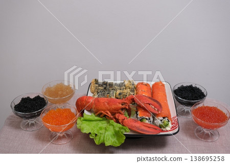 Lobster and assorted seafood caviar shrimp on table gourmet fresh luxury appetizer platter home kitchen close-up 138695258