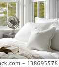 Cozy Bedroom with Soft Pillows and Book on Bed 138695578