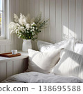 Cozy bedroom corner with white pillow and flowers 138695588