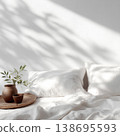 Cozy Bed with White Bedding and Sunlit Decor 138695593