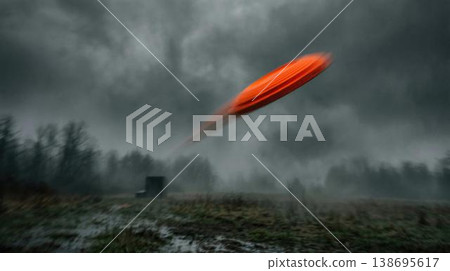 Fast-moving clay target in flight over muddy terrain, challenging outdoor shooting sport activity. 138695617