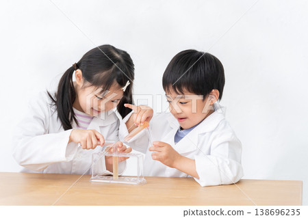 Children conducting science experiments using test tubes 138696235