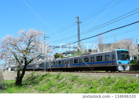Odakyu 4000 series 4057F and cherry blossoms 138696320