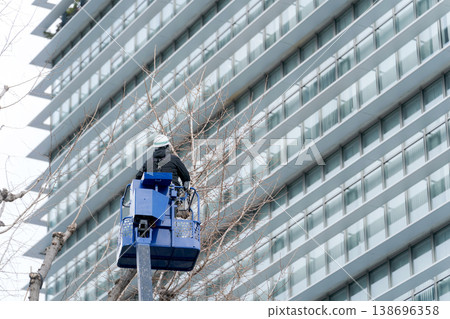 A crane used for pruning street trees. A crane used for pruning street trees. 138696358
