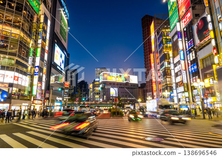 Tokyo, Japan - 2 March, 2024: Crowds of people at a busy crossing in Shinjuku at twilight on 2 March, 2024 in Tokyo, Japan Tokyo, Japan - 2 March, 2024: Crowds of people at a busy crossing in Shinjuku at twilight on 2 March, 2024 in Tokyo, Japan 138696546