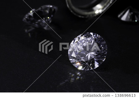 brilliant cut diamond held by tweezers on white background brilliant cut diamond held by tweezers on white background 138696613