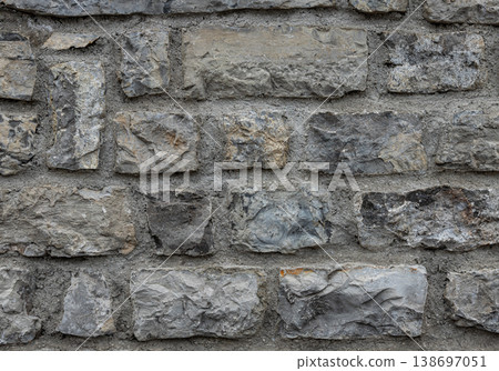 Gray stone wall texture background with rough masonry 138697051