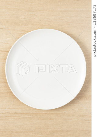 White plate placed on the table White plate placed on the table 138697172