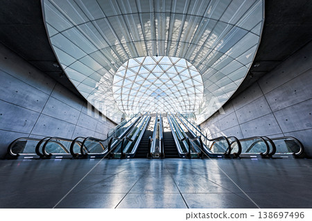 Geometric glass roof and modern escalators at Triangern station in Malmö, Sweden. Geometric glass roof and modern escalators at Triangern station in Malmö, Sweden. 138697496