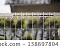 On a rainy day, raindrops on the fence look like jewels. 138697804