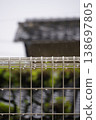 On a rainy day, raindrops on the fence look like jewels. 138697805