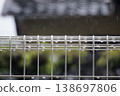 On a rainy day, raindrops on the fence look like jewels. 138697806