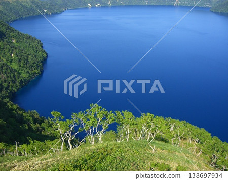 Lake Mashu and its small islands, with their beautiful Mashu Blue waters, offer a mystical natural landscape of Hokkaido. Lake Mashu and its small islands, with their beautiful Mashu Blue waters, offer a mystical natural landscape of Hokkaido. 138697934