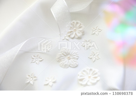 White ribbon and flower decoration White ribbon and flower decoration 138698378