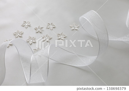 White ribbon and flower decoration White ribbon and flower decoration 138698379