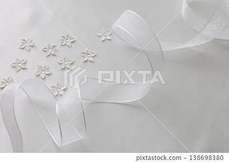 White ribbon and flower decoration White ribbon and flower decoration 138698380